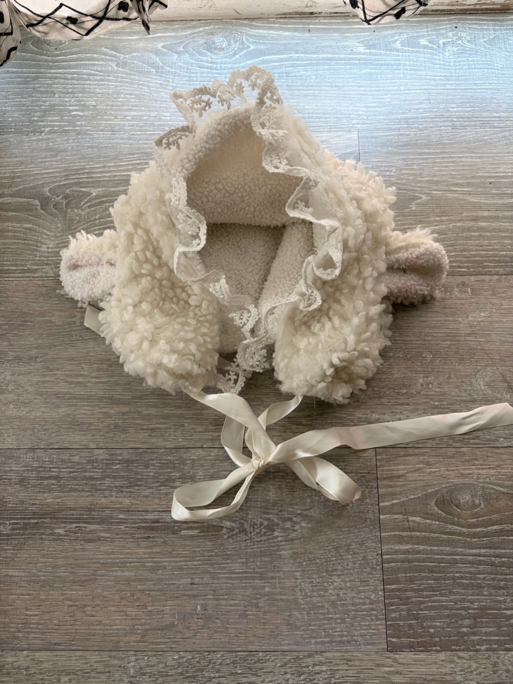 Faux fur, lace, and ribbon lamb bonnet